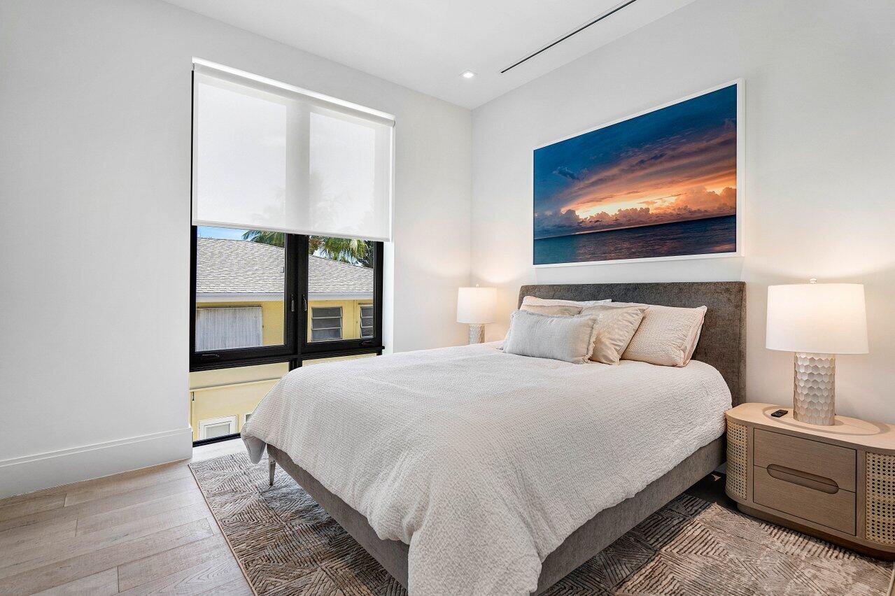 514 Northeast 7th Avenue Delray Beach, FL 33483 - Photo 37 of 51 a bedroom with a bed and a flat screen tv