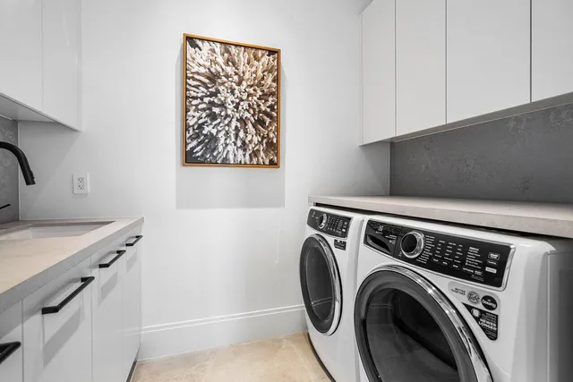 a kitchen with a sink and cabinets