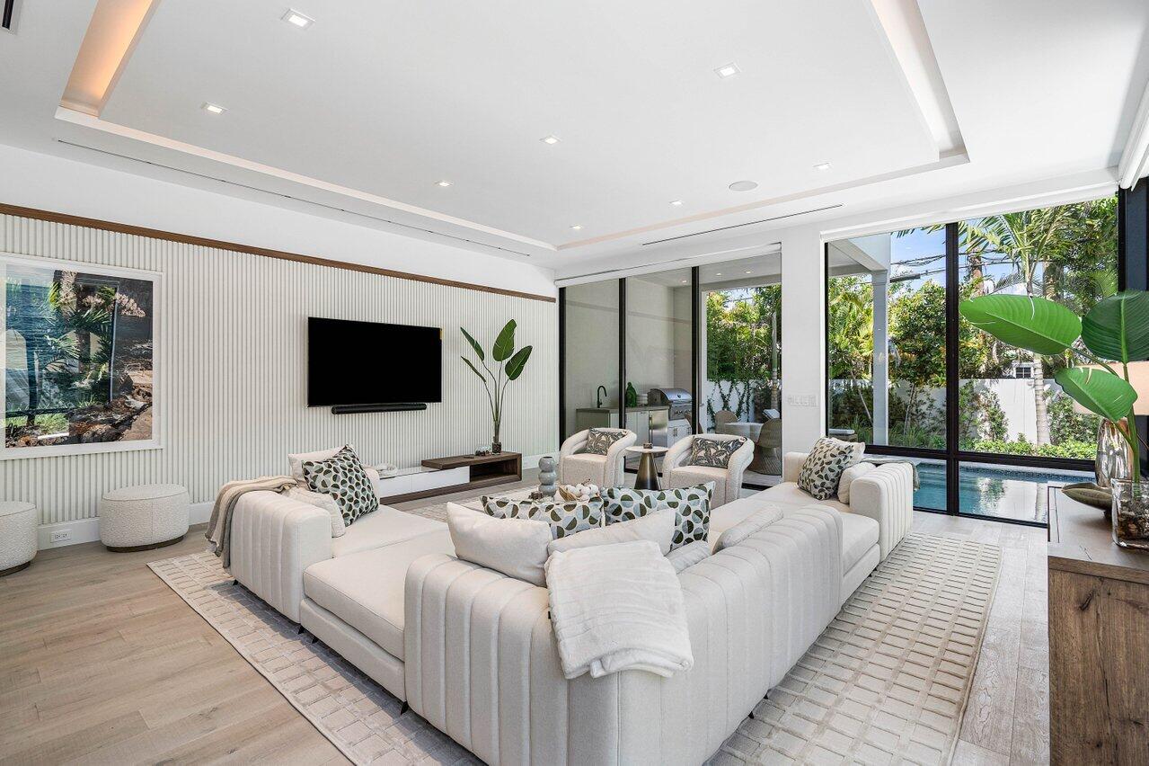 514 Northeast 7th Avenue Delray Beach, FL 33483 - Photo 5 of 51 a living room with furniture and a flat screen tv