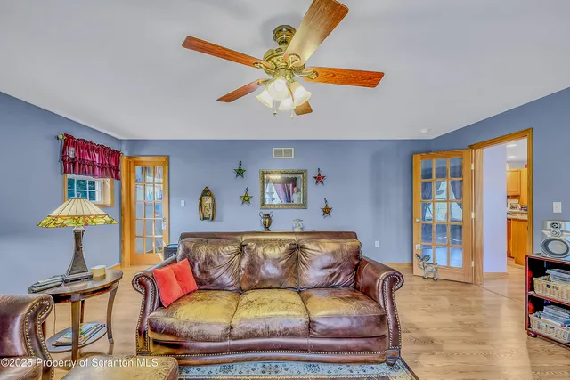 a living room with furniture and a window