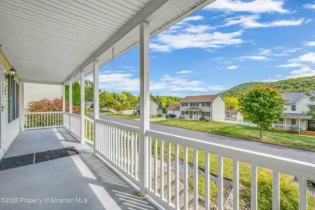 a view of a street from a balcony
