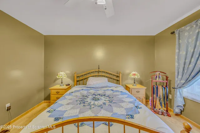 a bedroom with a bed and a table