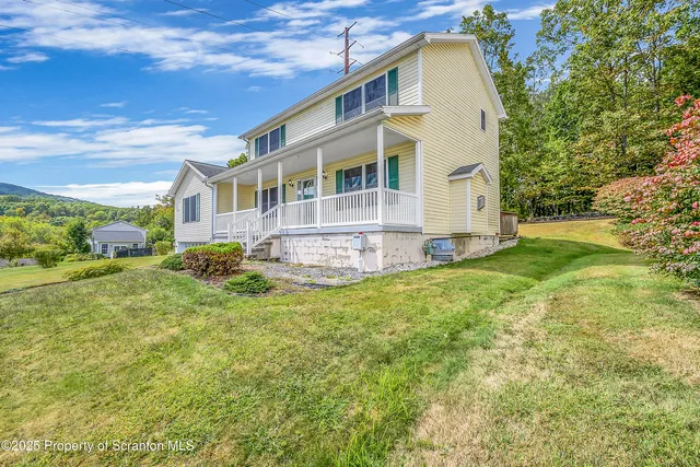 a house view with a garden space