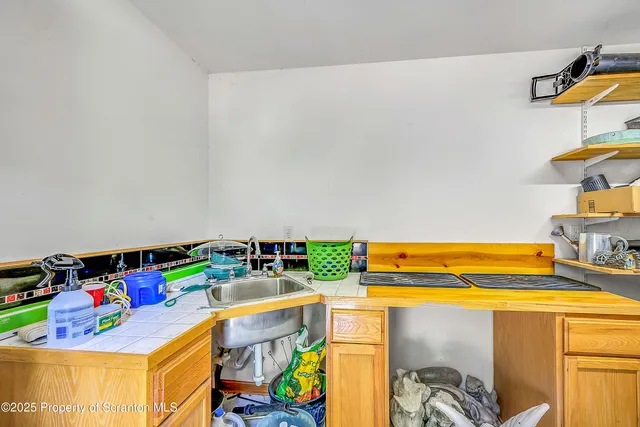 a view of storage and utility room with washer and dryer