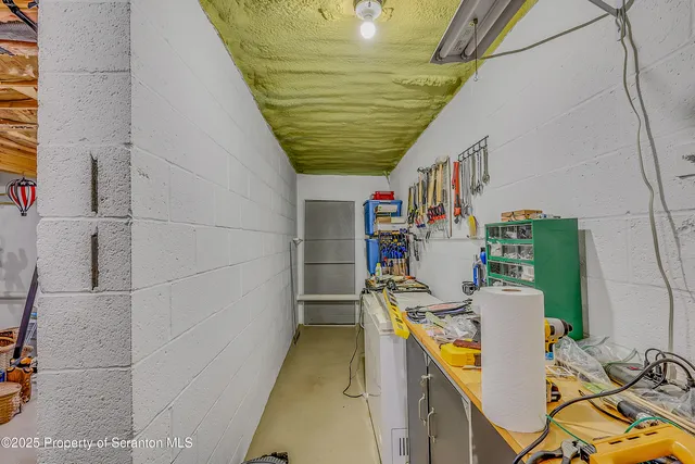 a living room with a couch and a rug