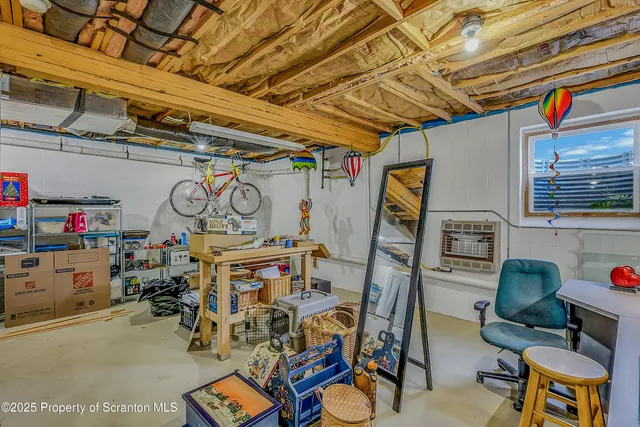 a bedroom with furniture and a wooden floor
