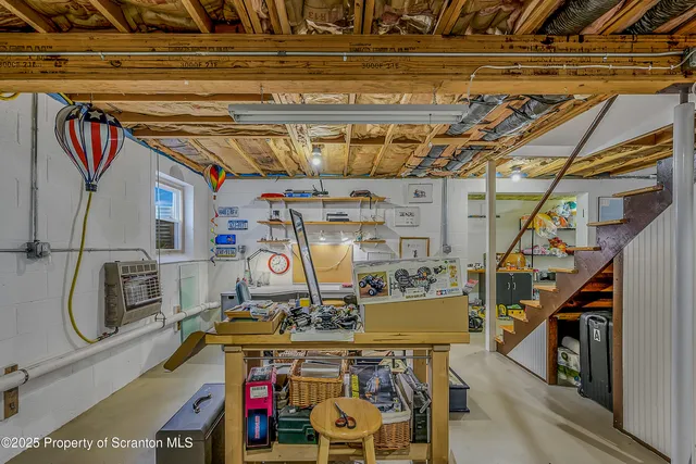 a view of a workspace with furniture