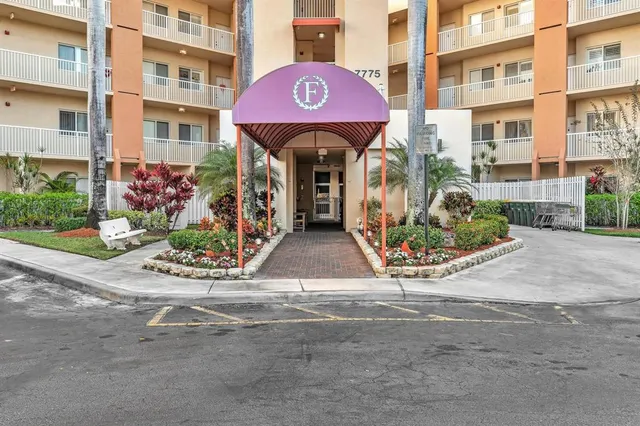 a view of front door with small yard