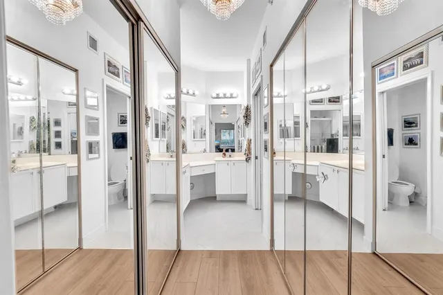 a bathroom with a sink a toilet and shower curtain