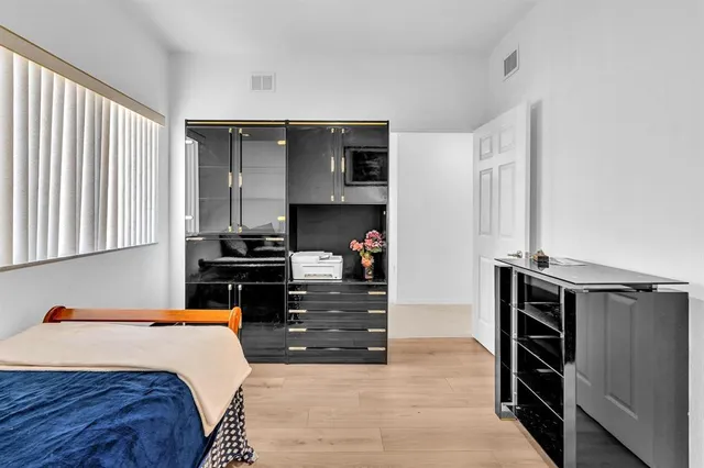 a view of a swimming pool with a patio and a yard