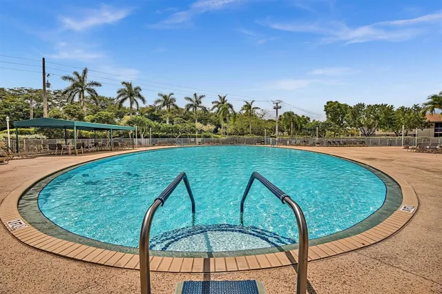 an aerial view of residential houses with outdoor space and river view