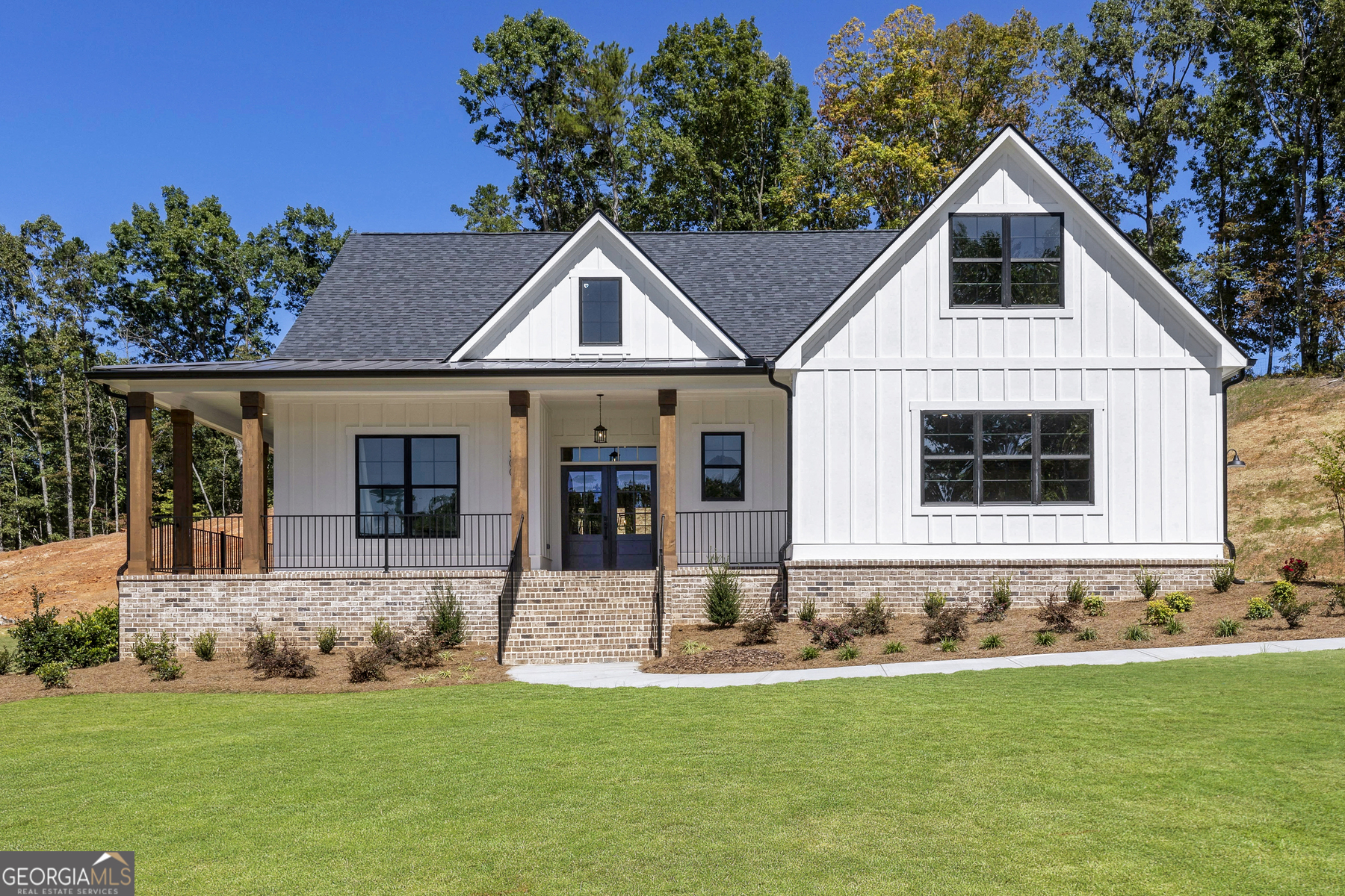 756 Oxford Road Ball Ground, GA 30107 - Photo 1 of 1 a front view of a house with a yard