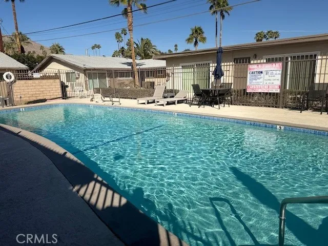 a view of a house with a backyard porch and sitting area