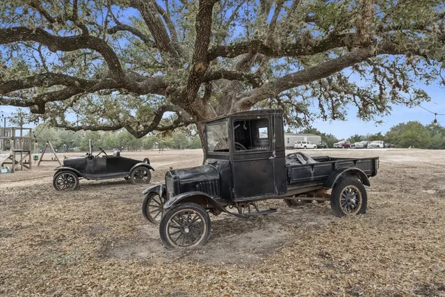 a view of a backyard with table and chairs