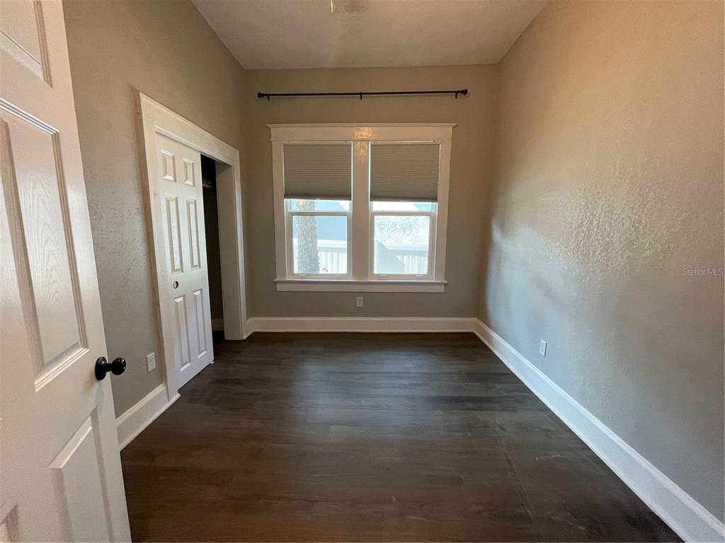 1932 West Spruce Street Tampa, FL 33607 - Photo 14 of 24 an empty room with wooden floor and windows