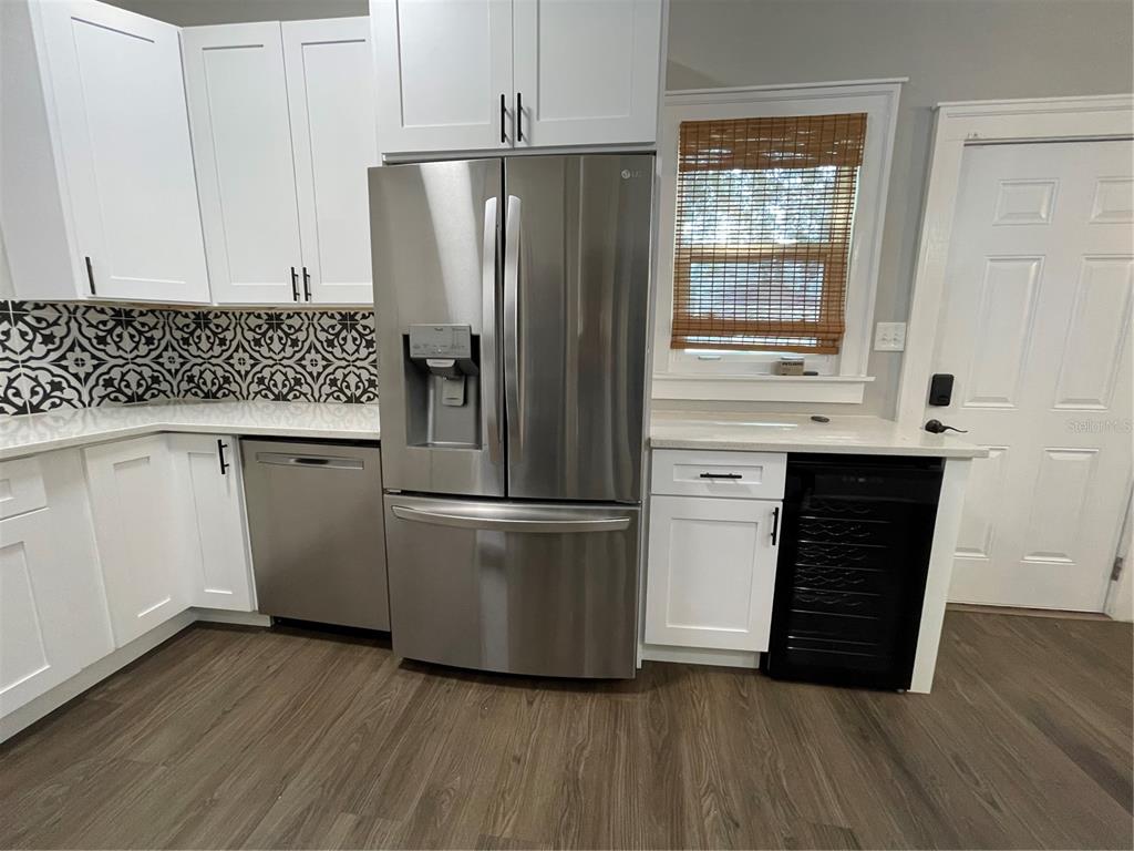1932 West Spruce Street Tampa, FL 33607 - Photo 5 of 24 a kitchen with a refrigerator and a sink