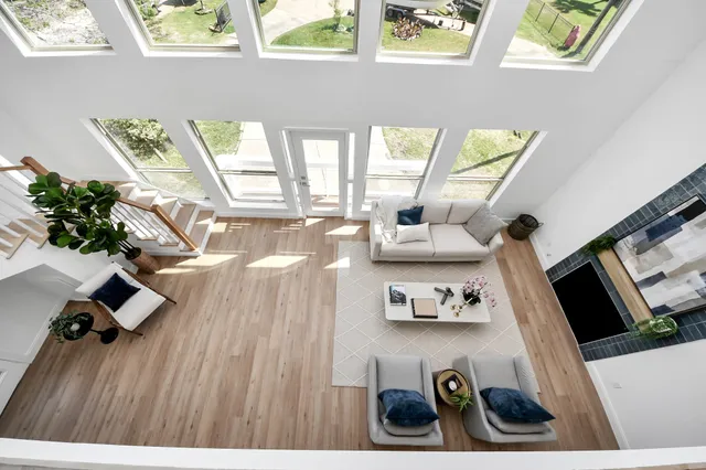 a bathroom with a double vanity sink mirror double shower and a toilet
