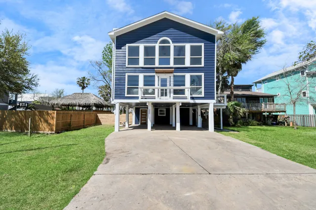 a view of balcony with wooden floor and fence