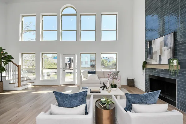 a living room with furniture and a large window