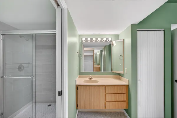 a bathroom with a shower and toilet