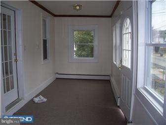 211 Dickinson Road Glassboro, NJ 08028 - Photo 2 of 10 a view of an empty room with a window