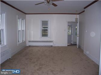 211 Dickinson Road Glassboro, NJ 08028 - Photo 3 of 10 a view of an empty room with a window