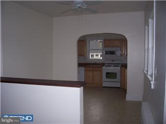 211 Dickinson Road Glassboro, NJ 08028 - Photo 4 of 10 a kitchen with a stove and a microwave