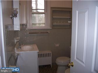 211 Dickinson Road Glassboro, NJ 08028 - Photo 7 of 10 a bathroom with a sink and toilet