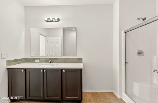 a view of storage and utility room with wooden floor
