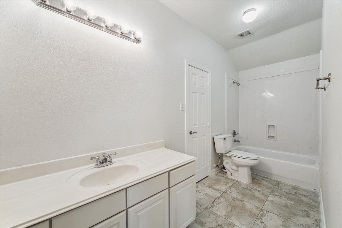 1805 Clover Patch Alvin, TX 77511 - Photo 11 of 14 a bathroom with a sink toilet and shower