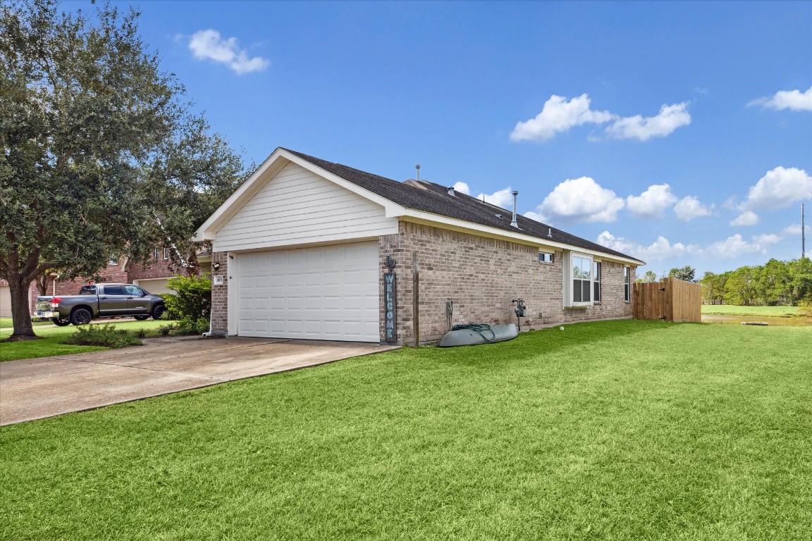 1805 Clover Patch Alvin, TX 77511 - Photo 3 of 14 a backyard of a house with table and chairs