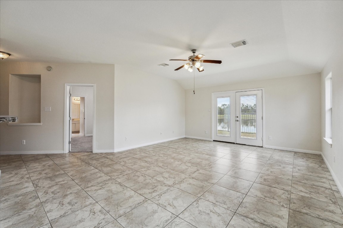 1805 Clover Patch Alvin, TX 77511 - Photo 4 of 14 a view of an empty room with a chandelier fan