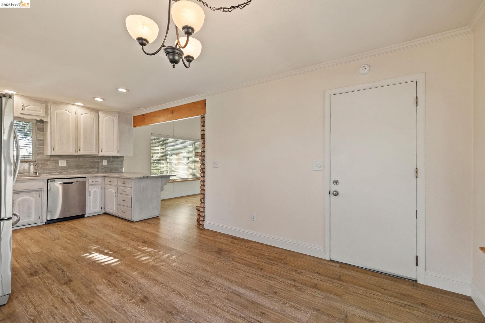 21916 Phoenix Lake Road Sonora, CA 95370 - Photo 13 of 48 a view of kitchen with wooden floor electronic appliances and window