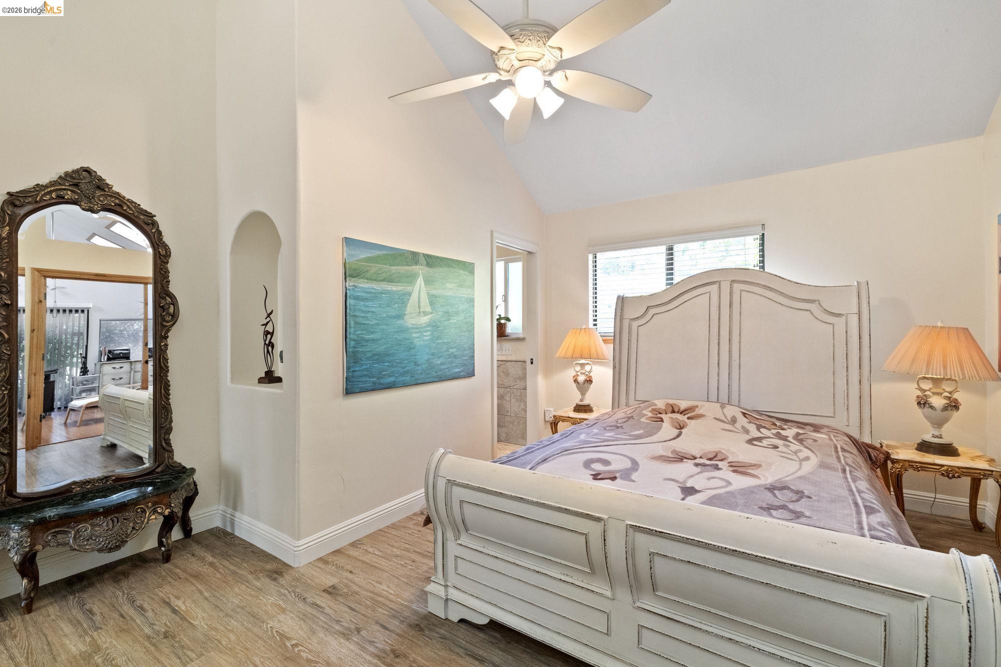 21916 Phoenix Lake Road Sonora, CA 95370 - Photo 17 of 48 a bedroom with a bed and a mirror on the dresser