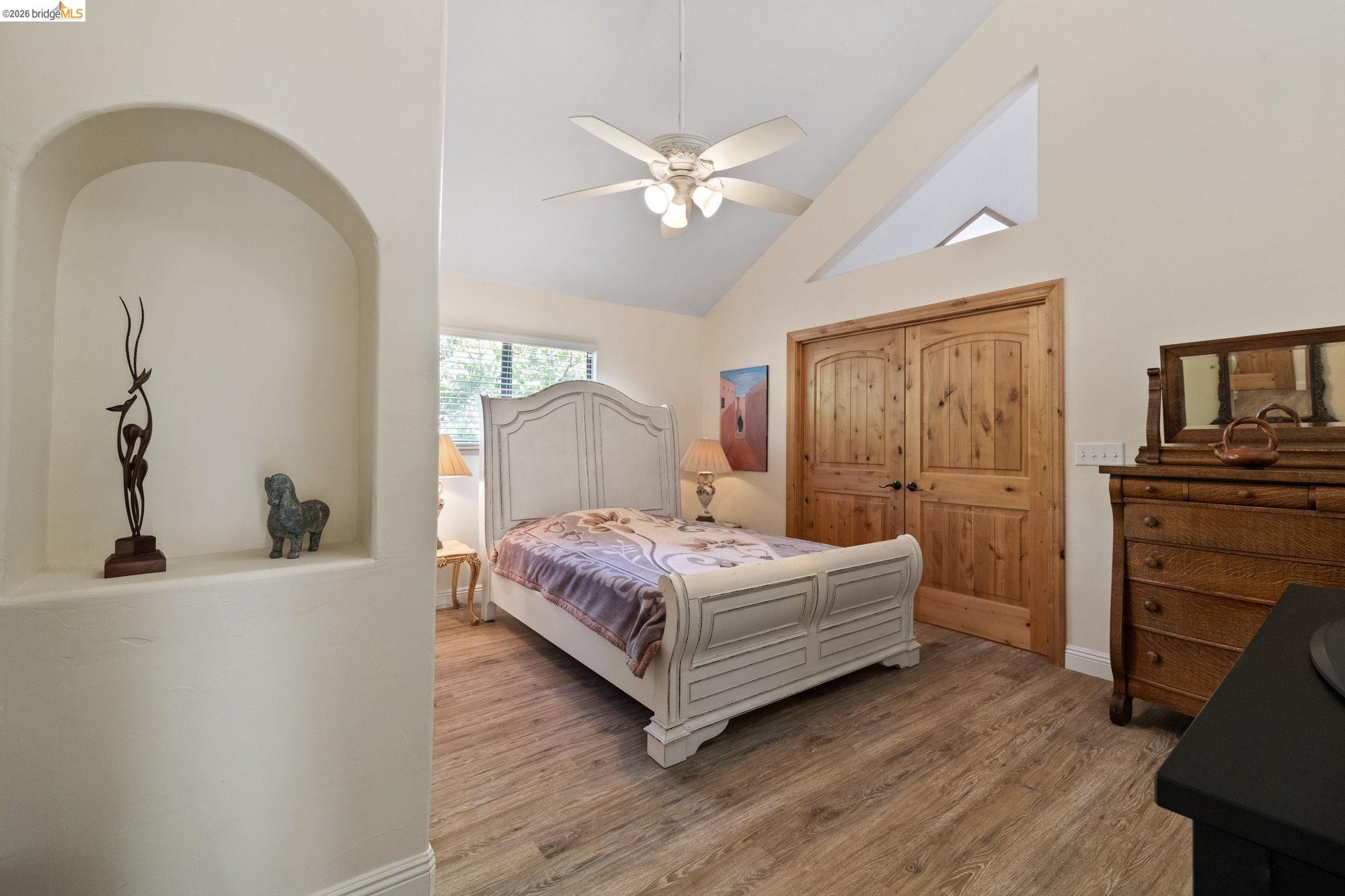 21916 Phoenix Lake Road Sonora, CA 95370 - Photo 18 of 48 a living room with a bed furniture and a window