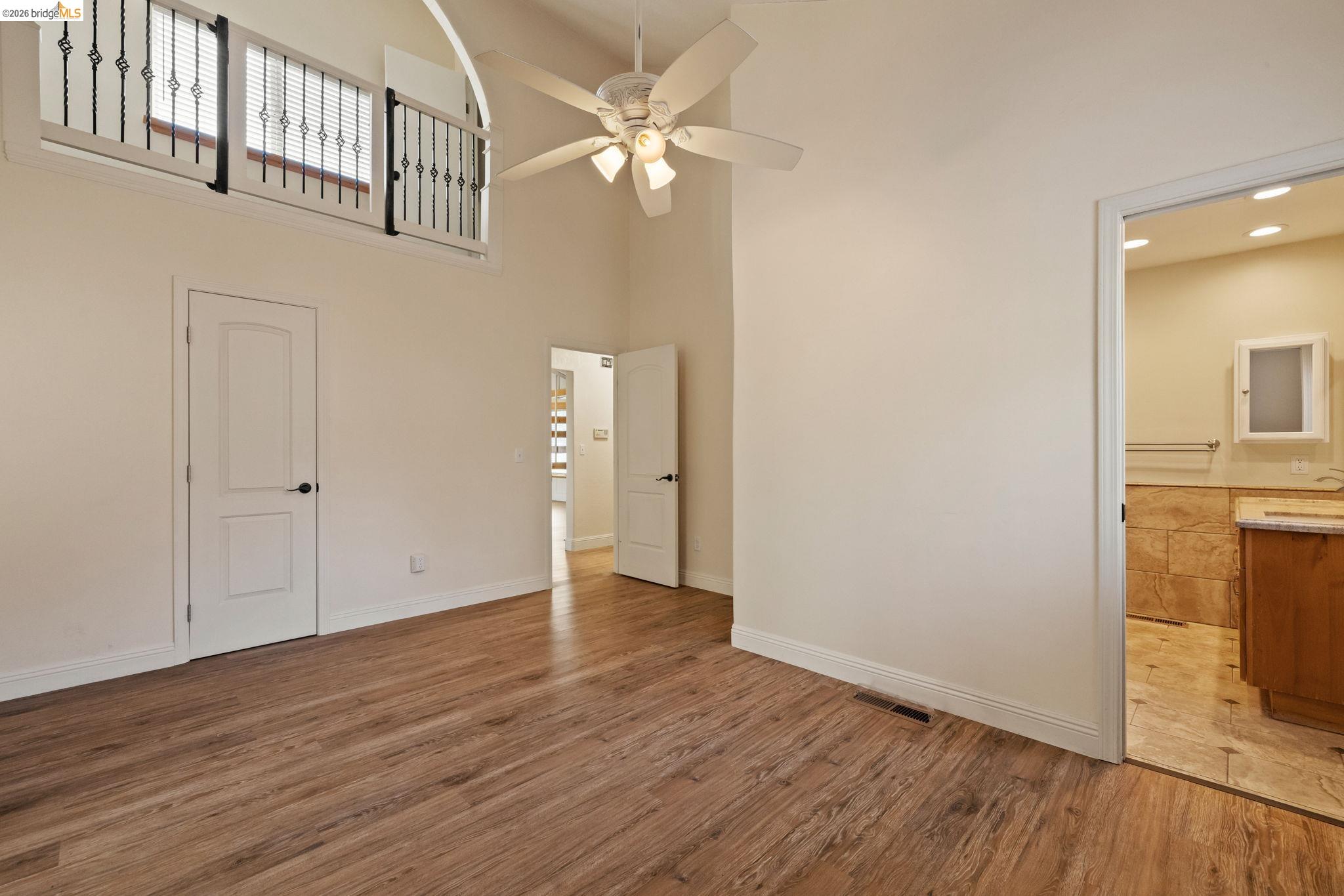 21916 Phoenix Lake Road Sonora, CA 95370 - Photo 19 of 48 a view of an empty room with wooden floor