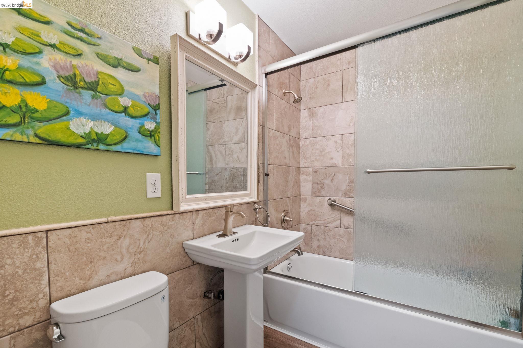 21916 Phoenix Lake Road Sonora, CA 95370 - Photo 28 of 48 a bathroom with a sink a toilet and shower