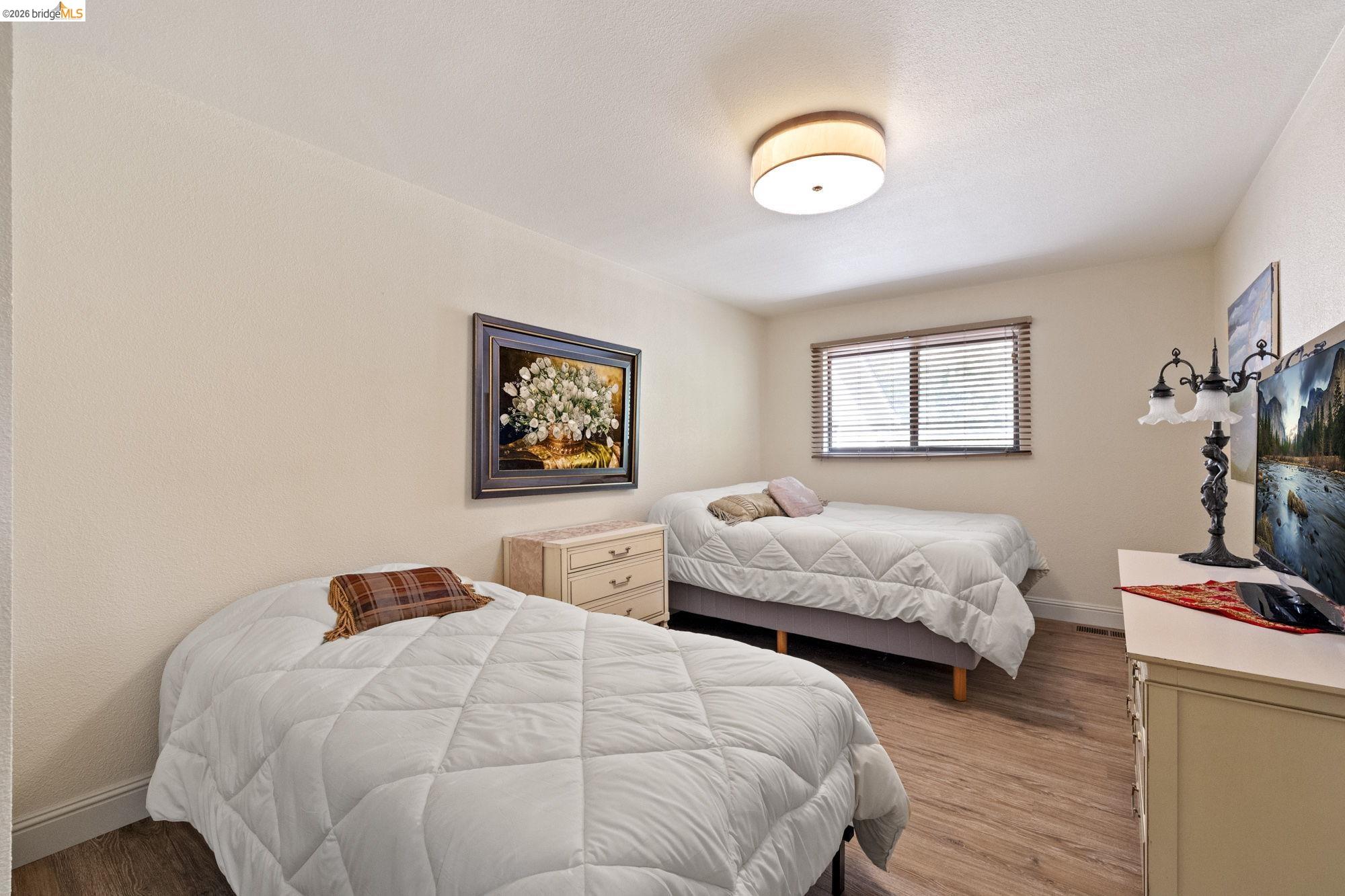 21916 Phoenix Lake Road Sonora, CA 95370 - Photo 30 of 48 a bedroom with two beds and a dresser