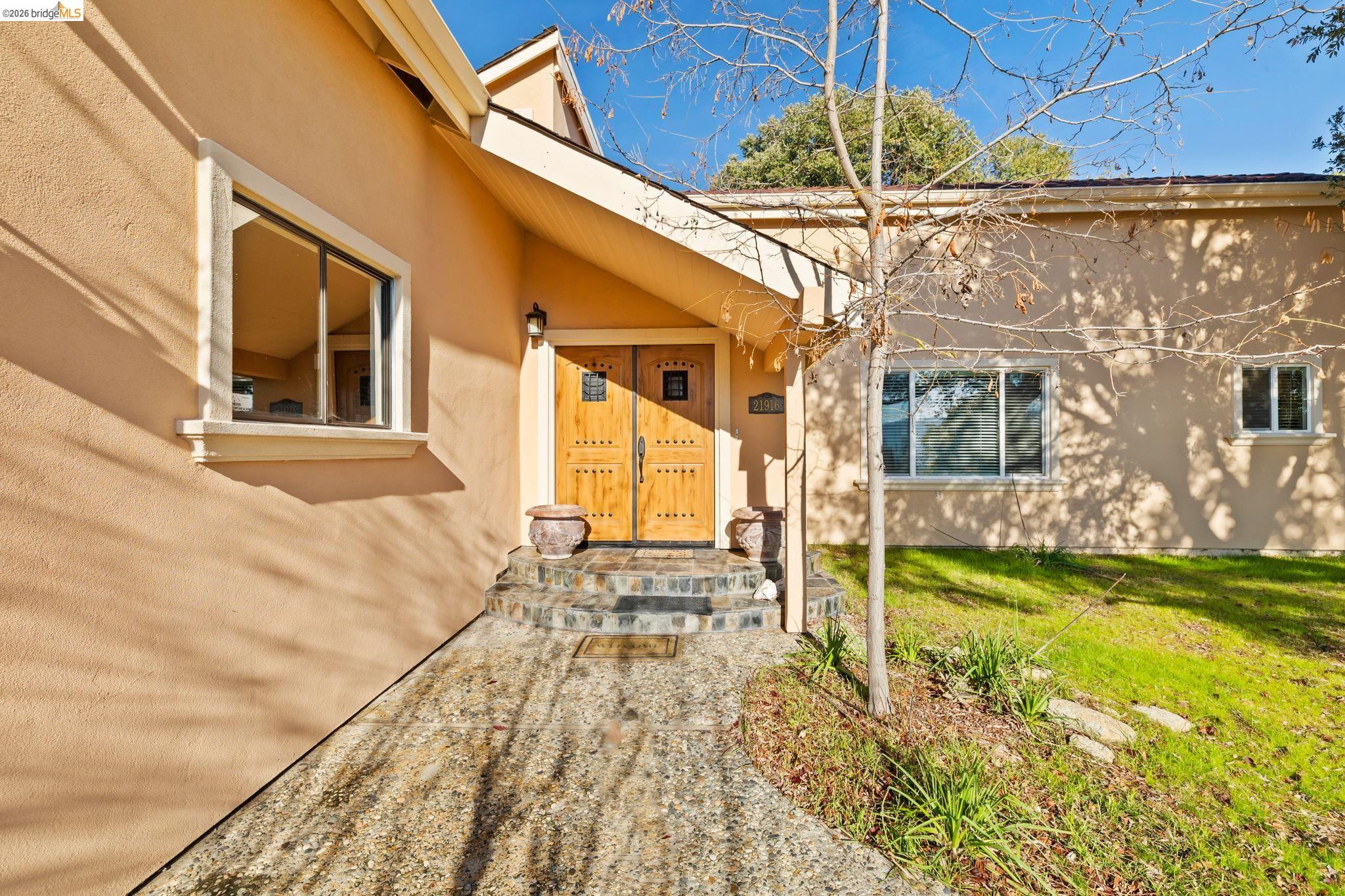 21916 Phoenix Lake Road Sonora, CA 95370 - Photo 3 of 48 a view of a house with a swimming pool