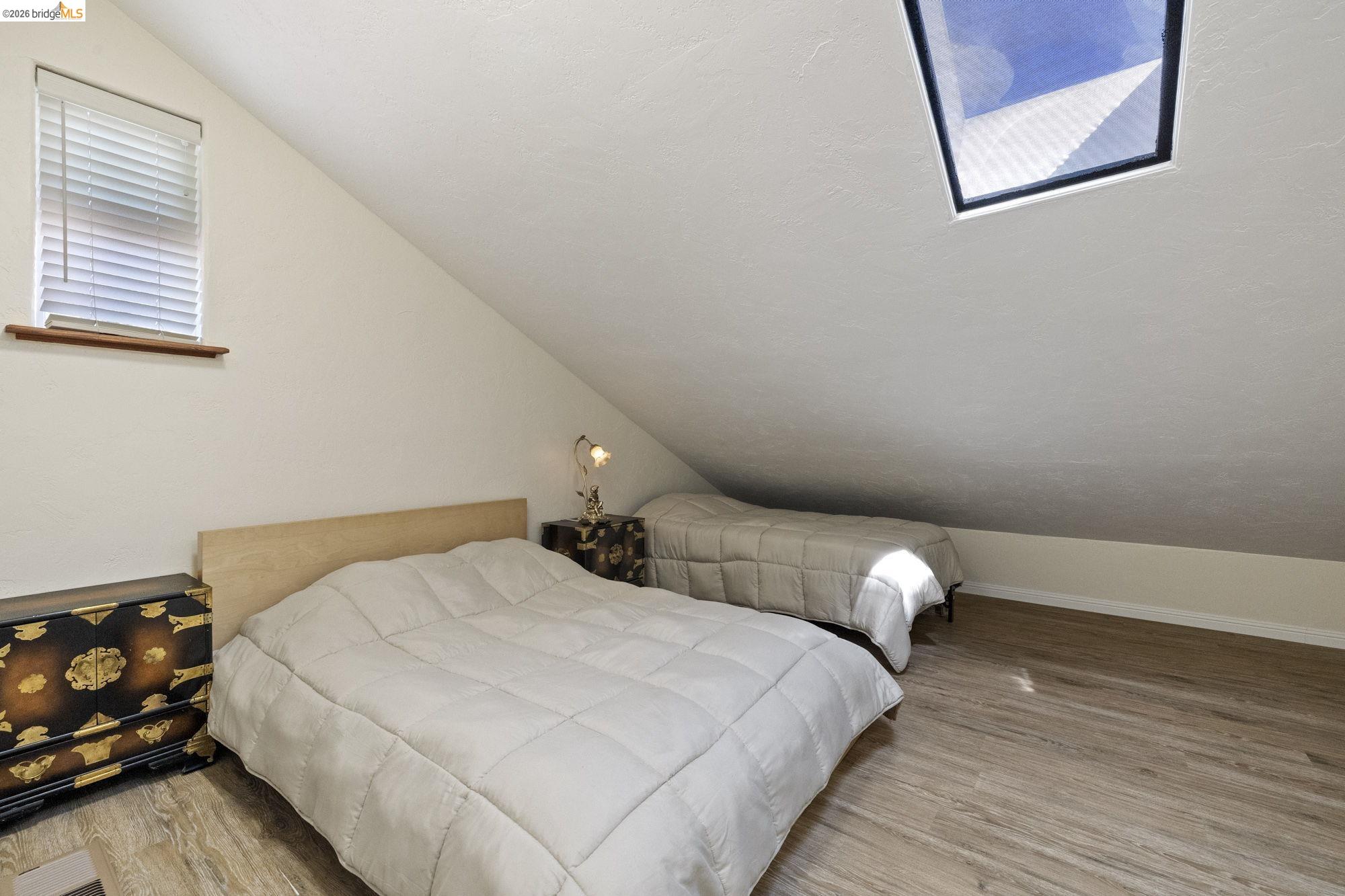 21916 Phoenix Lake Road Sonora, CA 95370 - Photo 33 of 48 a bedroom with bed and wooden floor