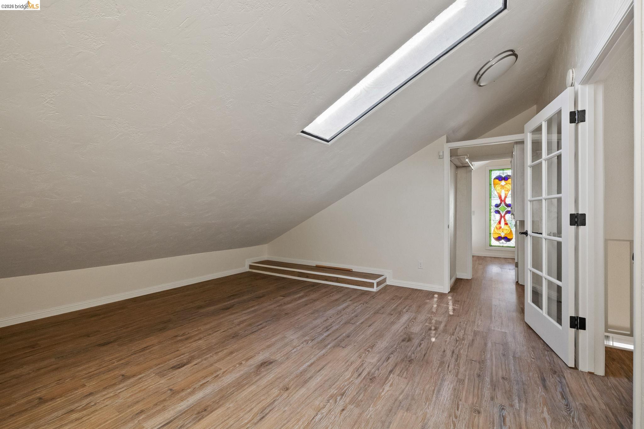 21916 Phoenix Lake Road Sonora, CA 95370 - Photo 34 of 48 a view of an empty room with wooden floor