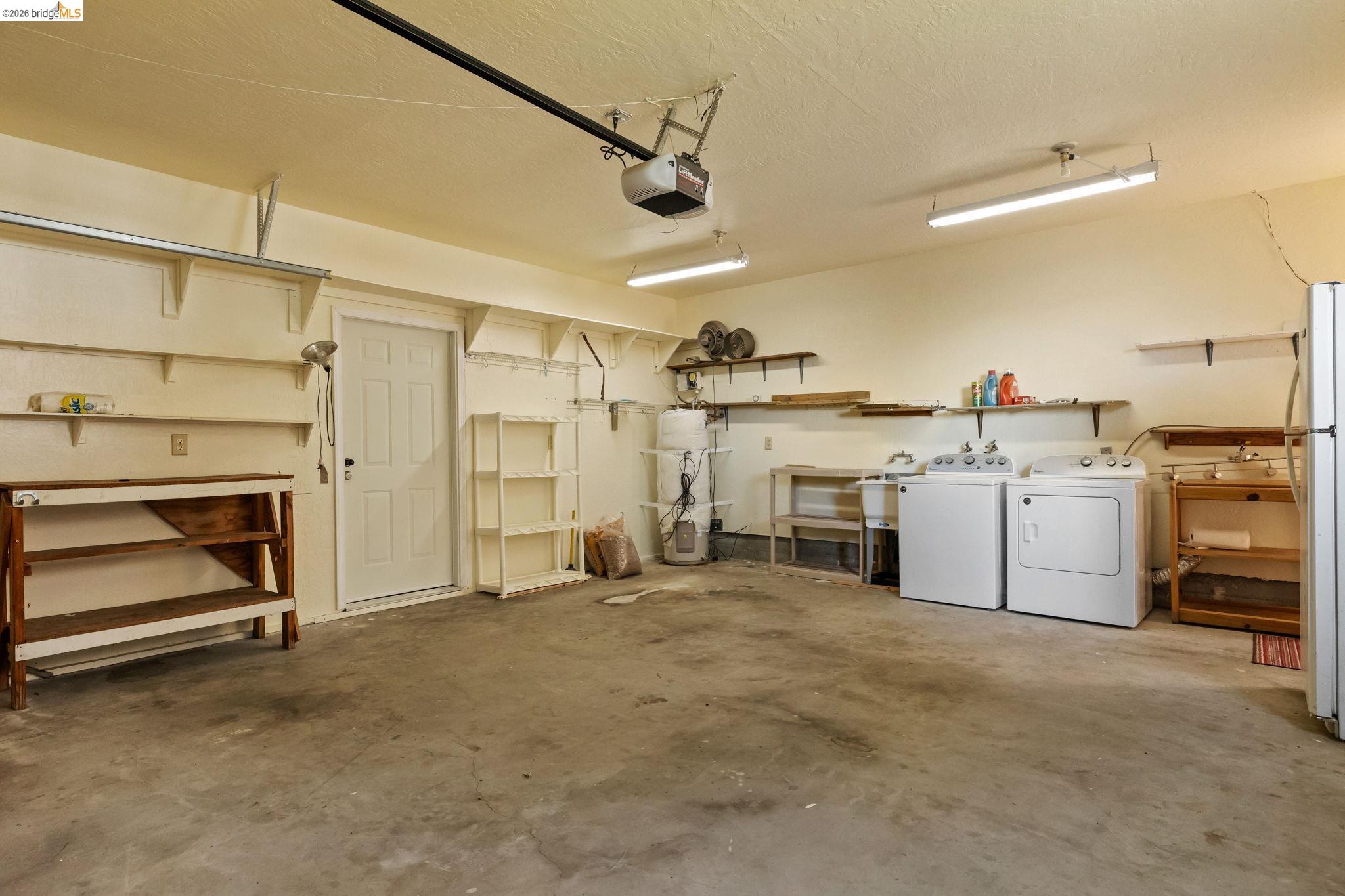 21916 Phoenix Lake Road Sonora, CA 95370 - Photo 36 of 48 a view of a storage & utility room with washer and dryer