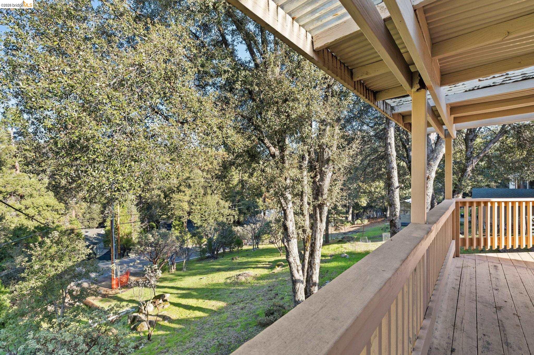 21916 Phoenix Lake Road Sonora, CA 95370 - Photo 37 of 48 a view of a yard with wooden deck