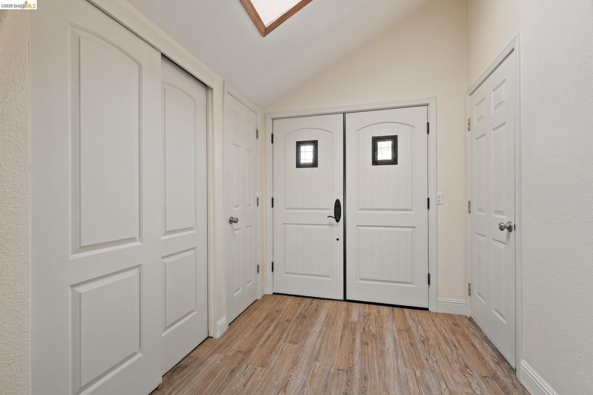 21916 Phoenix Lake Road Sonora, CA 95370 - Photo 4 of 48 a view of a hallway with wooden floor