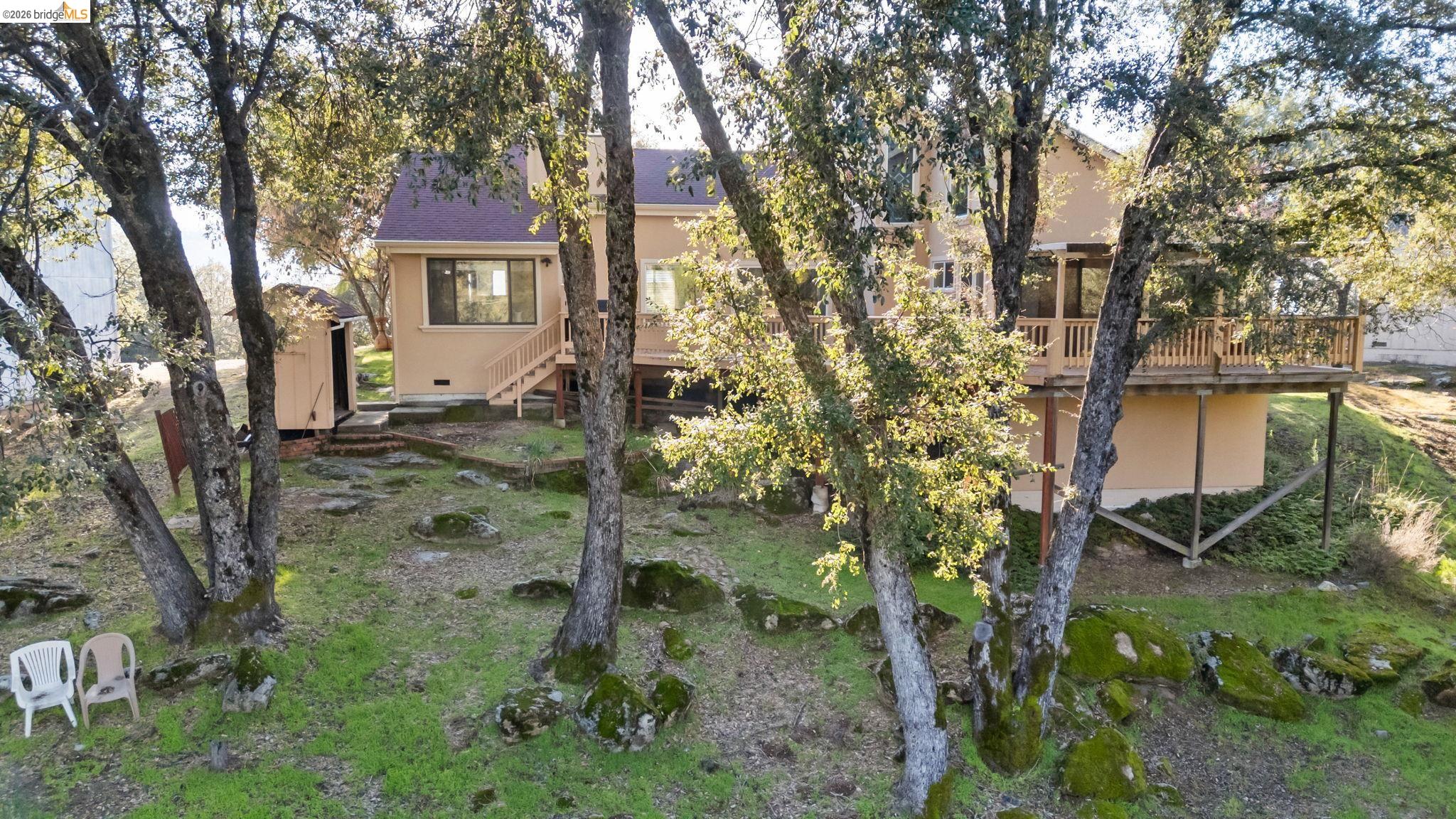 21916 Phoenix Lake Road Sonora, CA 95370 - Photo 44 of 48 a backyard of a house with lots of green space