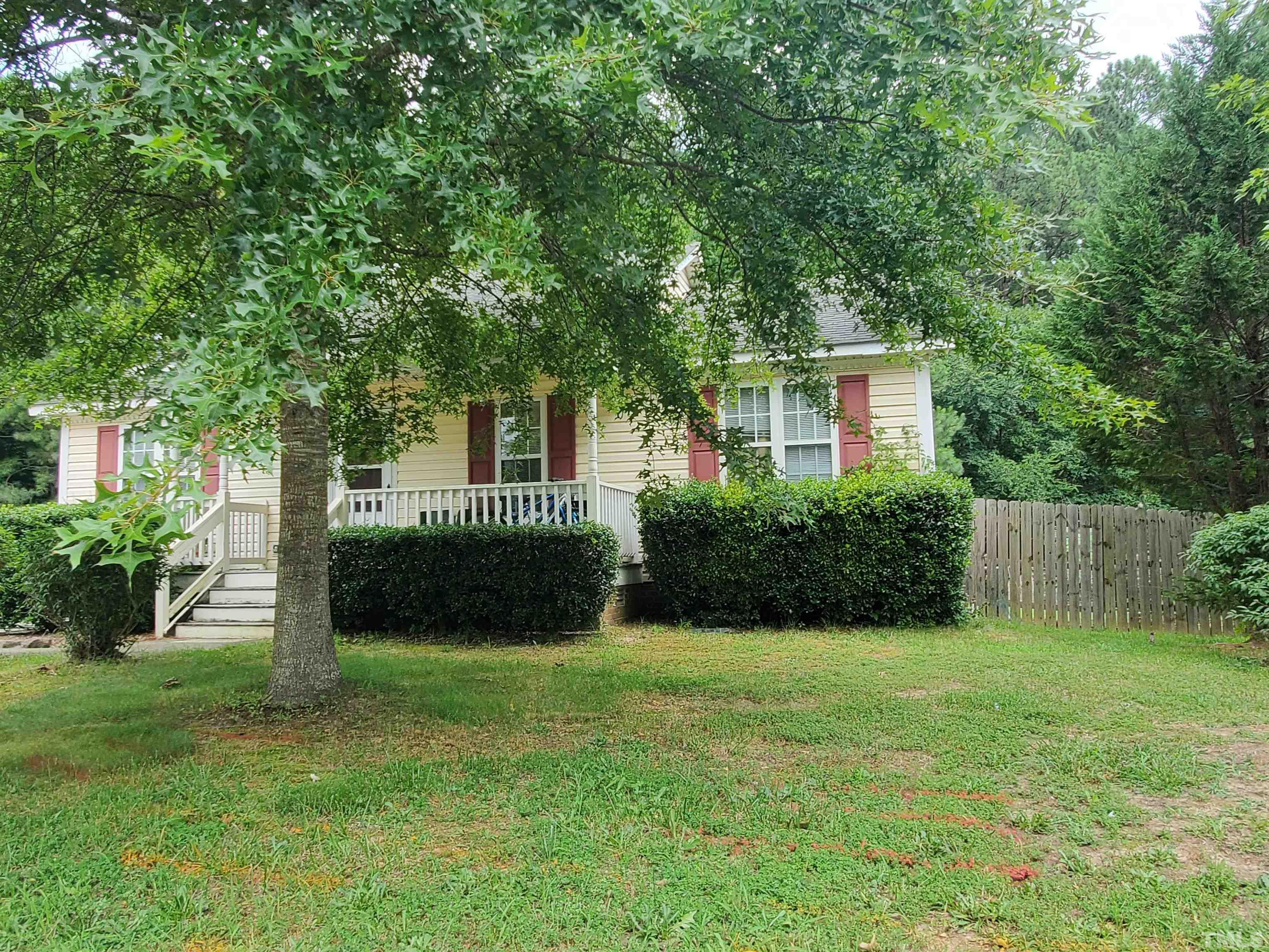 4204 Archibald Way Raleigh, NC 27616 - Photo 3 of 23 a view of a house with a yard and a garden