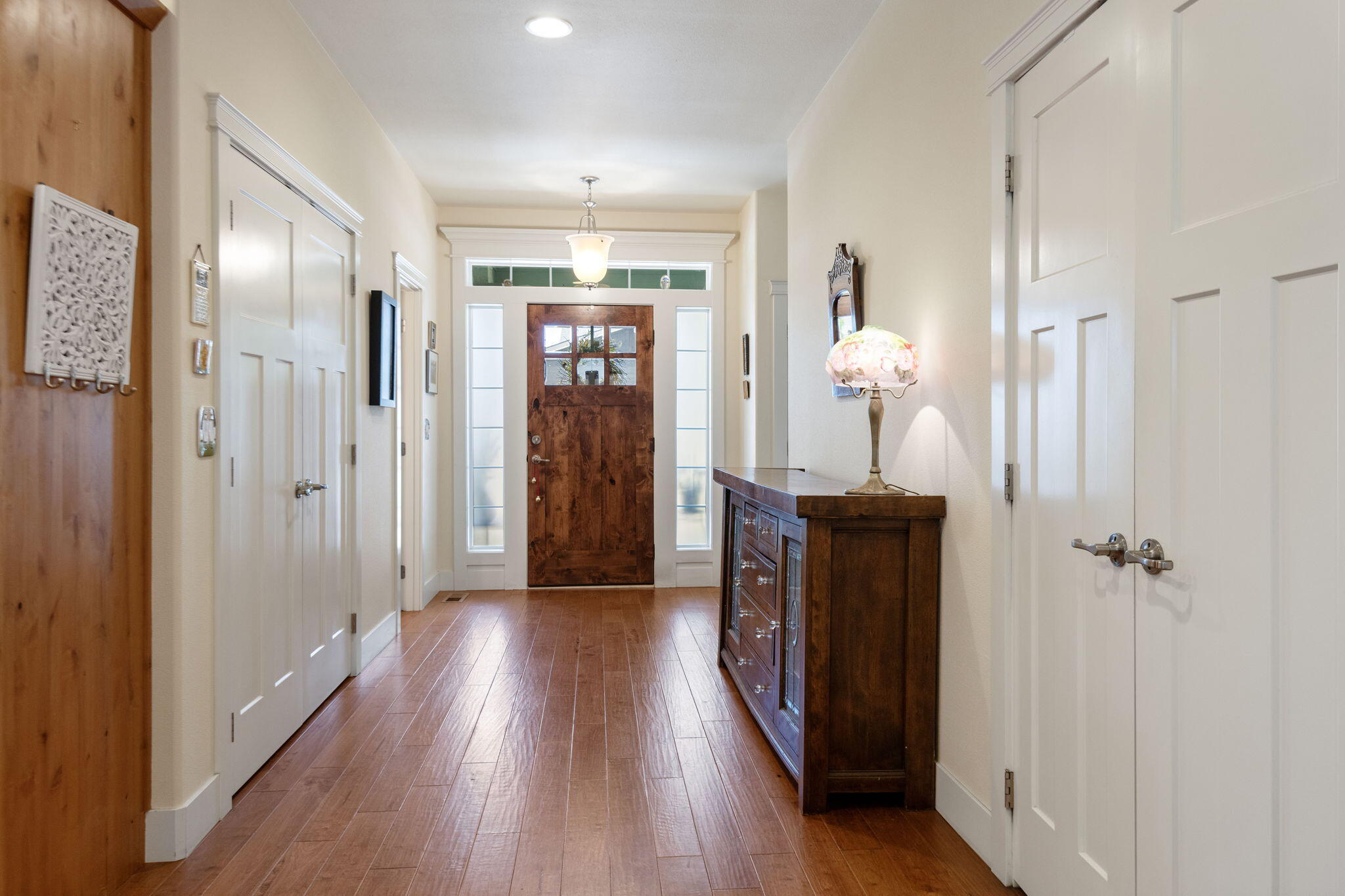 62944 Fresca Street Bend, OR 97703 - Photo 3 of 32 a view of a hallway with wooden floor