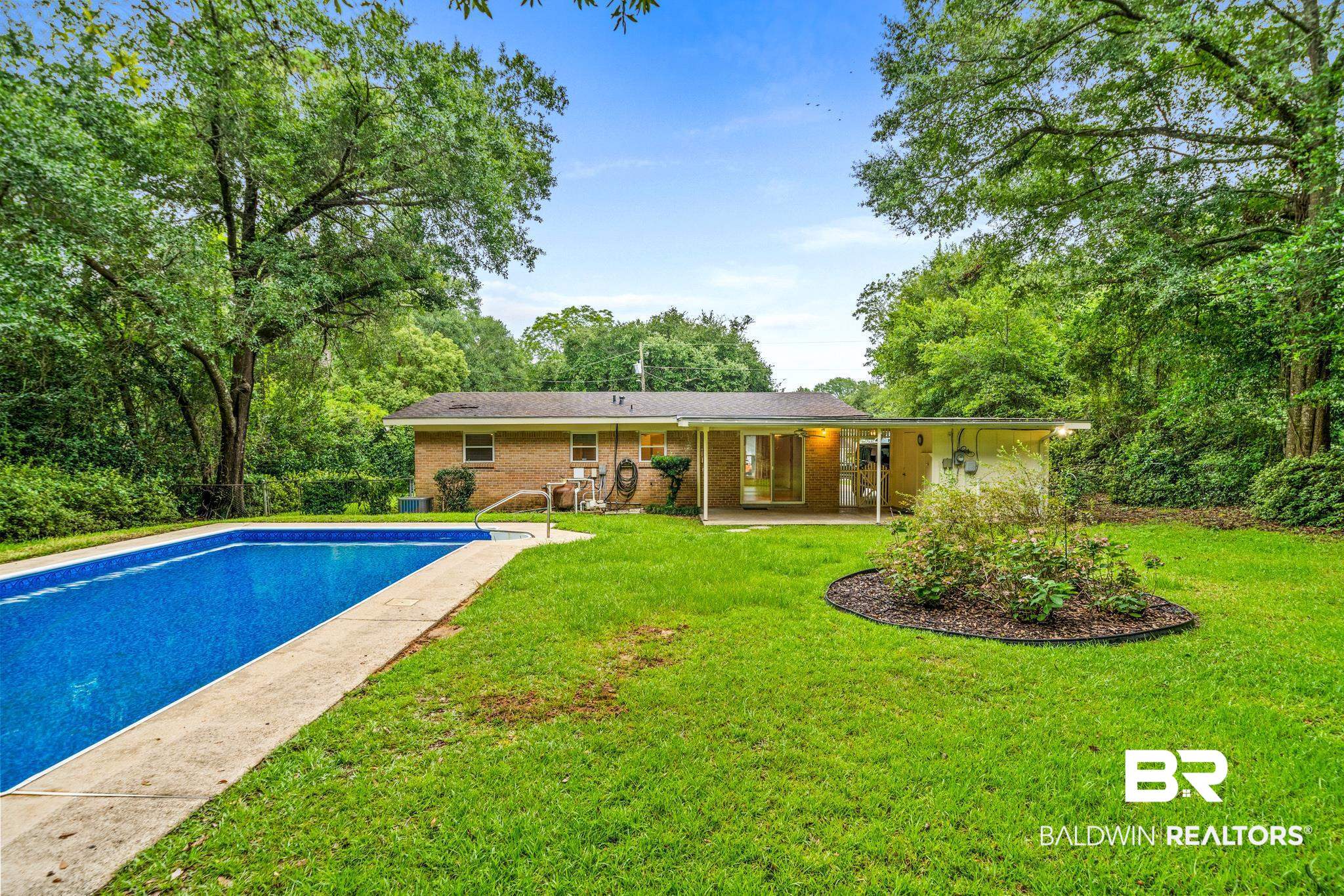 280 Thrift Street Mobile, AL 36609 - Photo 16 of 22 View of swimming pool with a lawn