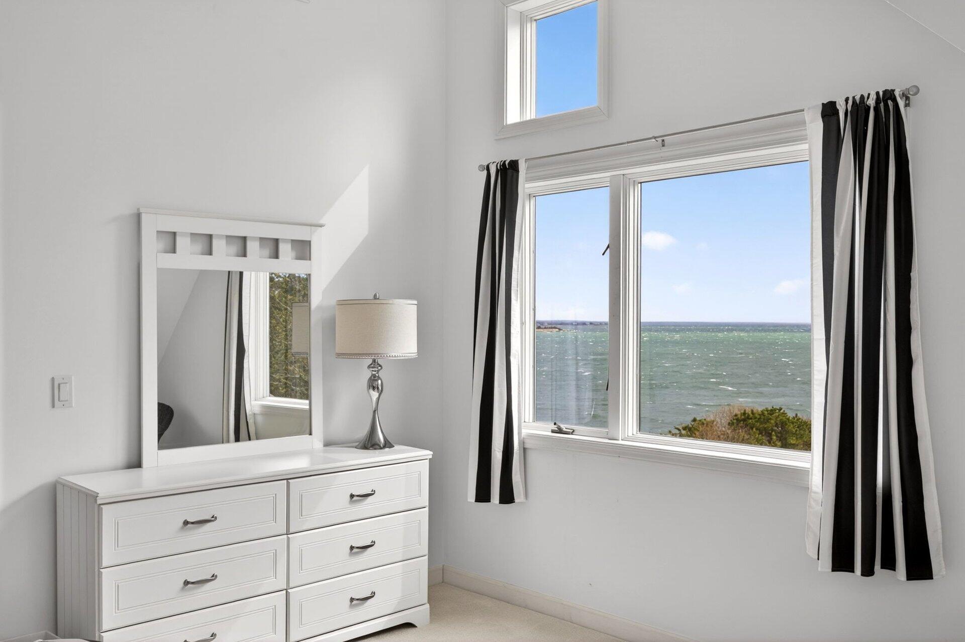 461 Wings Neck Road Pocasset, MA 02559 - Photo 27 of 42 a bathroom with a double vanity sink and mirror