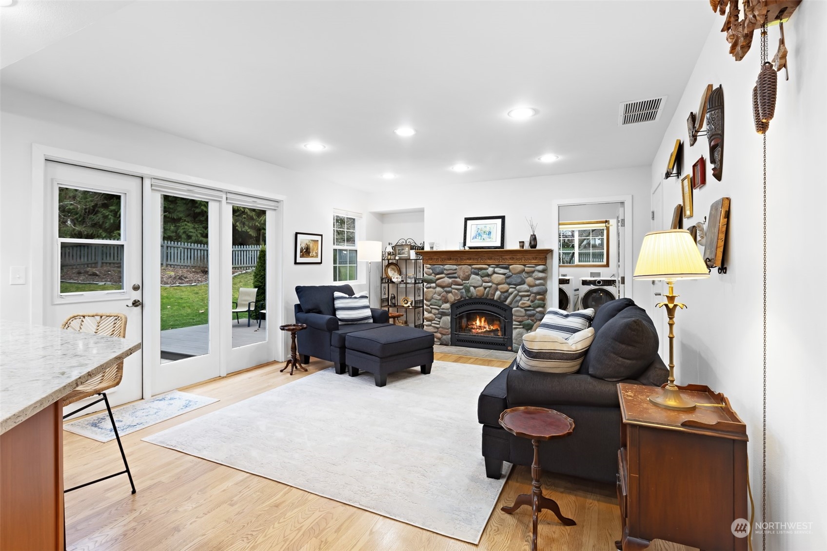 443 Doe Run Road Sequim, WA 98382 - Photo 10 of 39 a living room with furniture and a fireplace